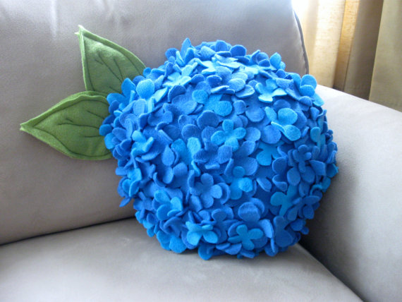 blue decorative cushion with floral designs