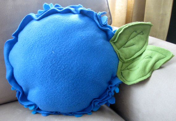 round decorative cushion made of blue felt
