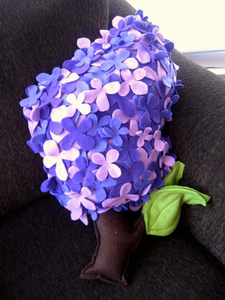 lilac and blue decorative cushion with floral designs