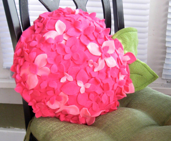 pink decorative pillows with floral designs