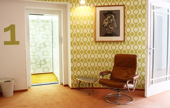 retro wallpaper patterna and brown chair