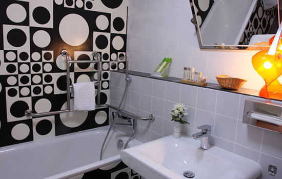 retro bathroom with black-n-white wall tiles