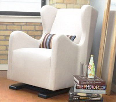 white upholstered chair with striped pillow