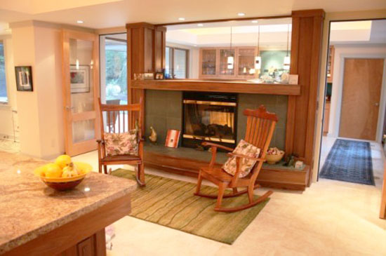 wooden chairs beside fireplace