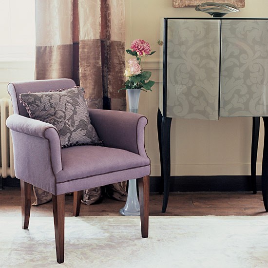 purple upholstered chair with cushion