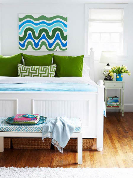 blue wall decor with green pillows