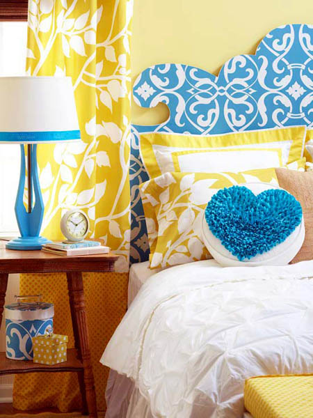 blue bed headboard and table lamp