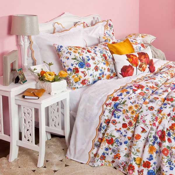 white bedding set and floral designs