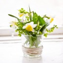flower arrangement in glass vase for table decorations