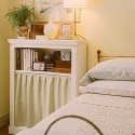 bedside table in white color with curtain