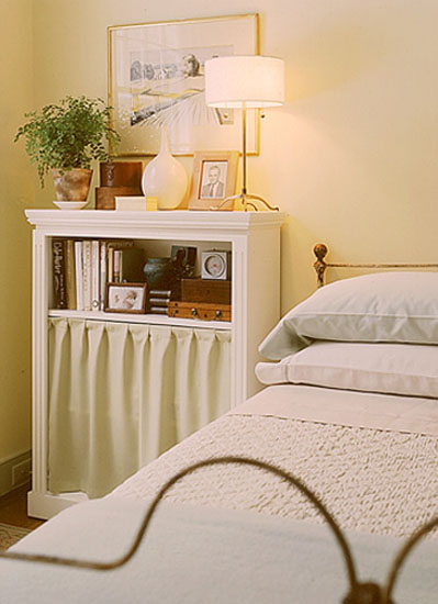 bedside table in white color with curtain