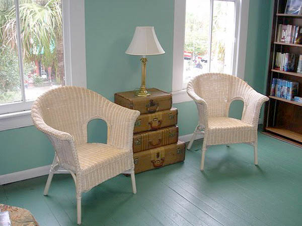 two chairs with side table made of old suitcases