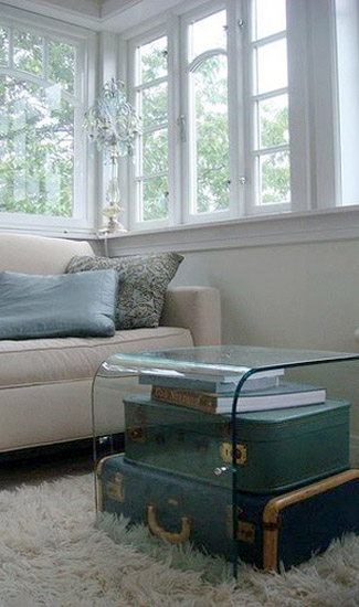 bedside table made of old suitcases covered with glass