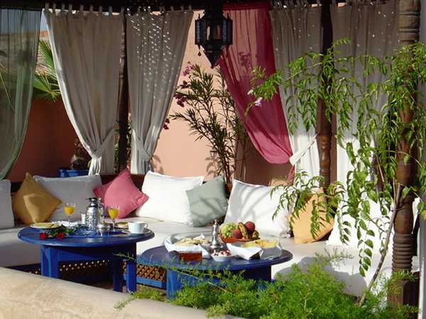 white and pink curtains and bed cushion