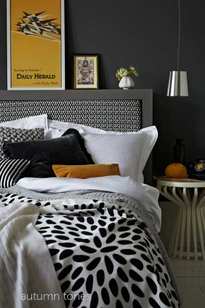 black and white bedding with pillows in yellow color