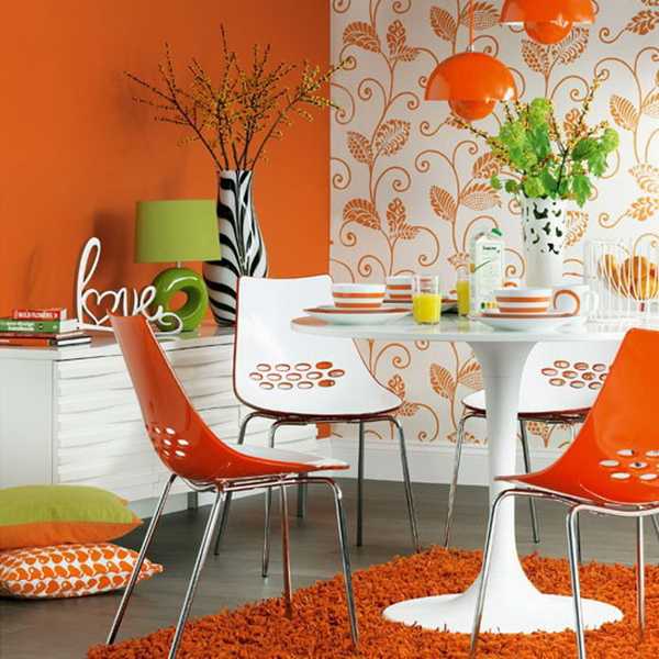 orange wall paint and chairs