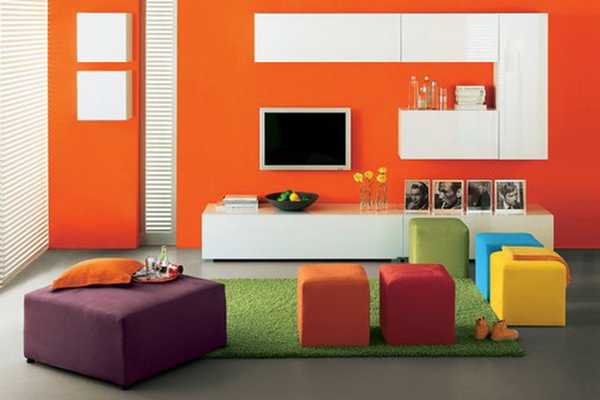 orange wall paint and white storage furniture