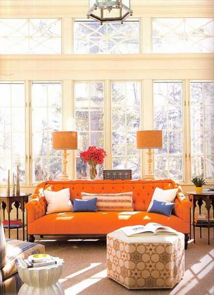 orange lampshades and orange sofa