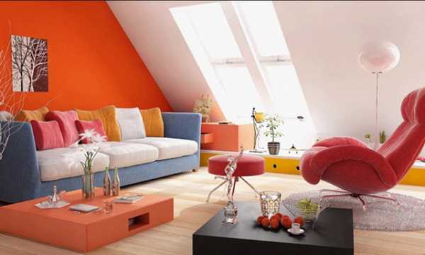orange wall paint and blue sofa
