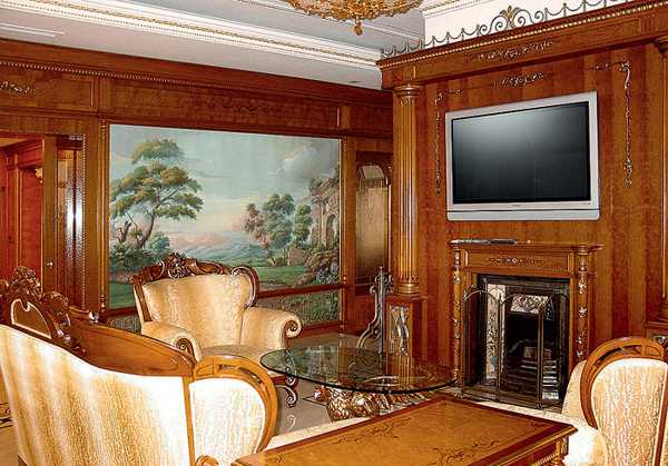 Wooden furniture for the living room and TV panel above fireplace