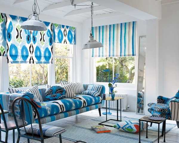 blue window shutters and sofa upholstery fabric with Ikat patterns and stripes