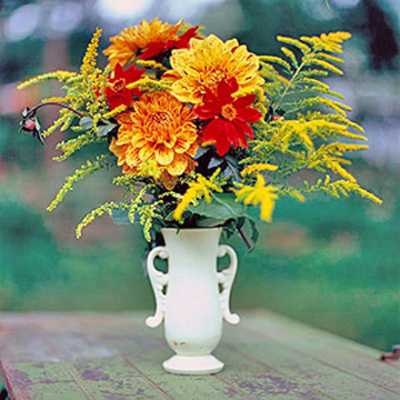 falling white vase with flowers