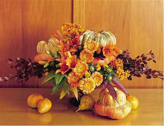 fall flower arrangement and fruits for table decorations