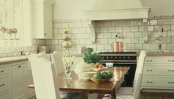 wooden dining table and white chairs