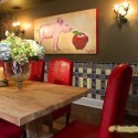 solid wood dining table with red leather chairs