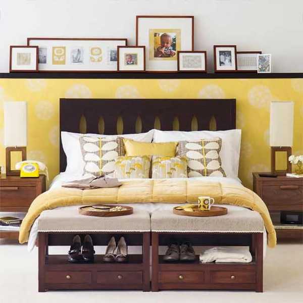 dark wood bedroom furniture and yellow wall decoration