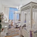 kids bedroom decorating with two four post beds in white