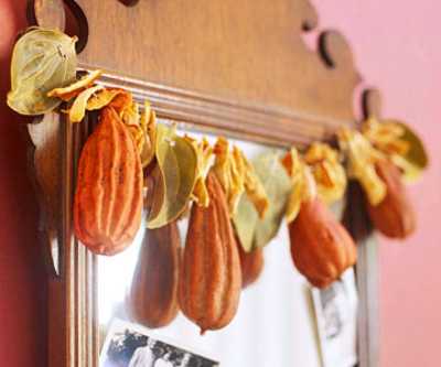 mirrors and wall decorations with pumpkins and autumn leaves garland