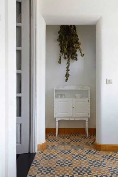 white wall decoration with dry leaves