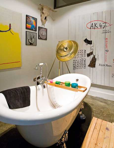 small bathroom decor, claw foot tub and yellow wall art