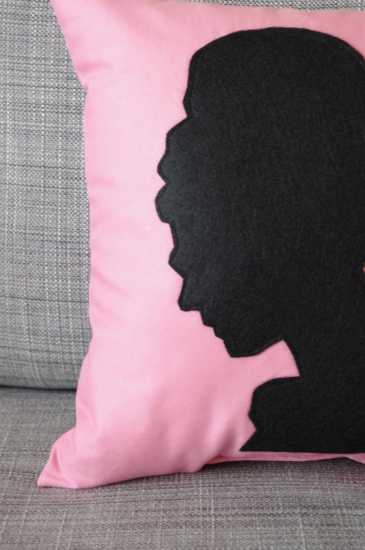  black silhouette on pink pillow 