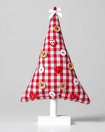 white and red fabric christmas tree decorated with buttons