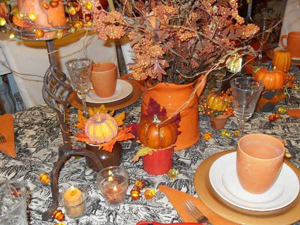 fall flower arrangement and orange tableware