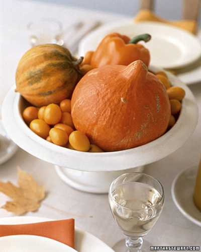 pumpkins and gourds in white vase for Thanksgiving decoration