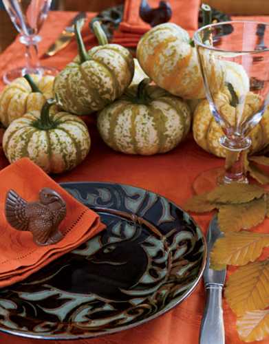 custom table decoration with chocolate turkey and orange napkins