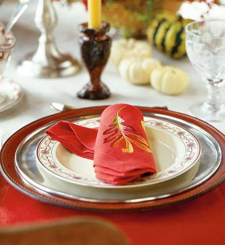 red napkin with fall leaf embroidery