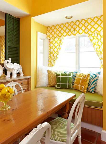 window seat with cushions and curtains in yellow and green
