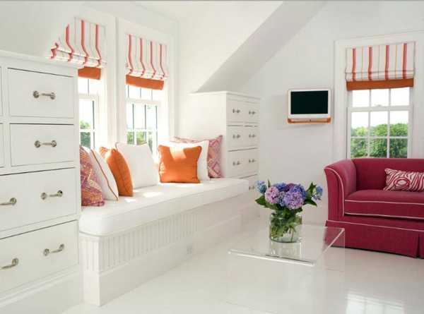 white bench with cushions and curtains in orange color