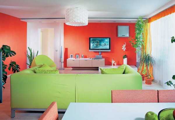 red wall and green living room furniture