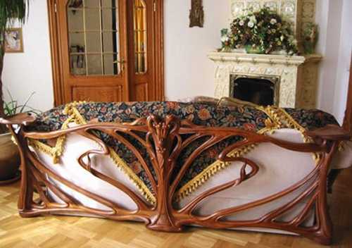 carved wood sofa in the living context