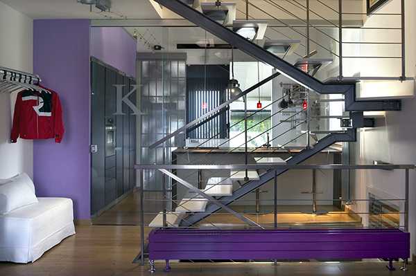 steel staircase design and purple wall paint color