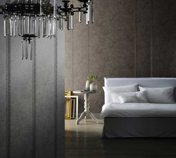 bedroom decor with gray wallpaper pattern and glass chandelier