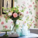 floral wallpaper and antique glass vases with flowers