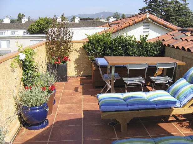 Terrace with blue pots and outdoor furniture