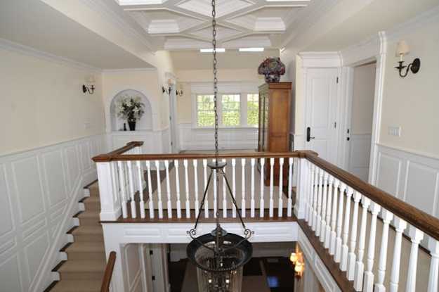large chandeliers and traditional staircase Design