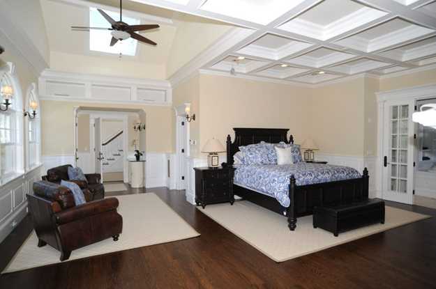 bedroom decoration with wooden furniture and white carpets